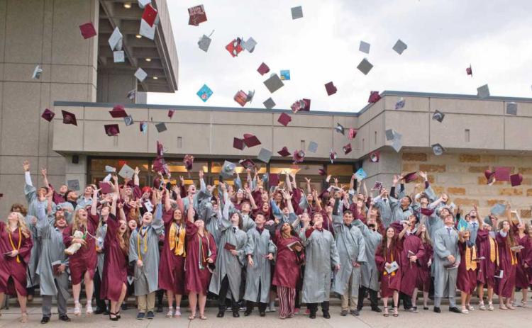 Rossford High School graduates toss their caps into the air after being officially proclaimed the graduating Class of 2023.