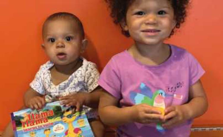 Kendrick Bruce is Rossford Public Library’s newest graduate of the “1,000 Books Before Kindergarten” program. Pictured with his sister, Katie, Kendrick is seven months old. He loves cooing, cuddling, playing, people-watching and pulling hair. He is working hard on trying to walk, loves being outside and enjoys being in the stroller, but only when it is moving. Congratulations to Kendrick from the staff of the Rossford Library!