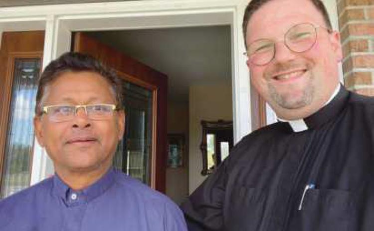 Father Antony Britto, left, and Father Scott Woods, pastor, are the new priests serving at All Saints Catholic Church.