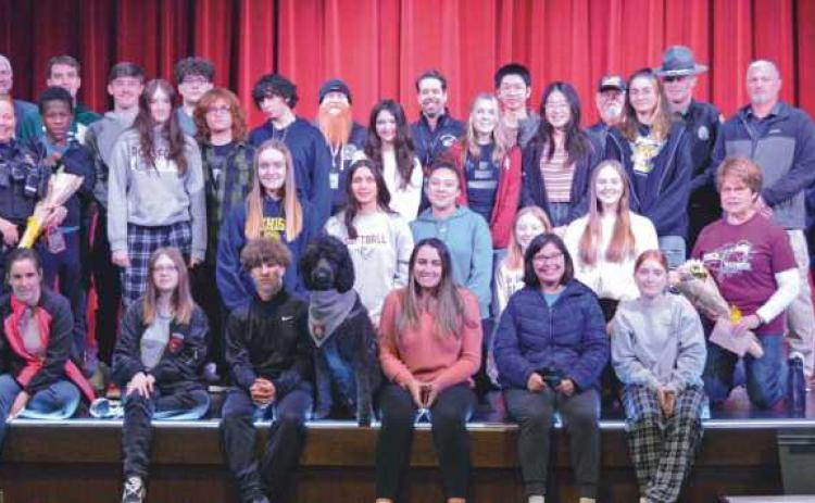 Above are the Rossford students who participated in the Distracted Driving billboard contest coordinated by Safe Communities of Wood County. With the students are area law enforcement officers and contest sponsors.