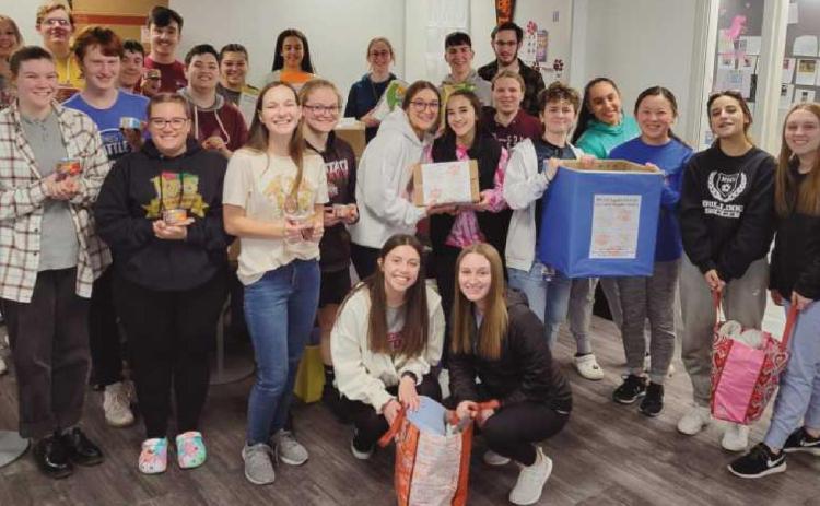 Members of the RHS National Honor Society with some of the items donated for the Toledo Humane Society.