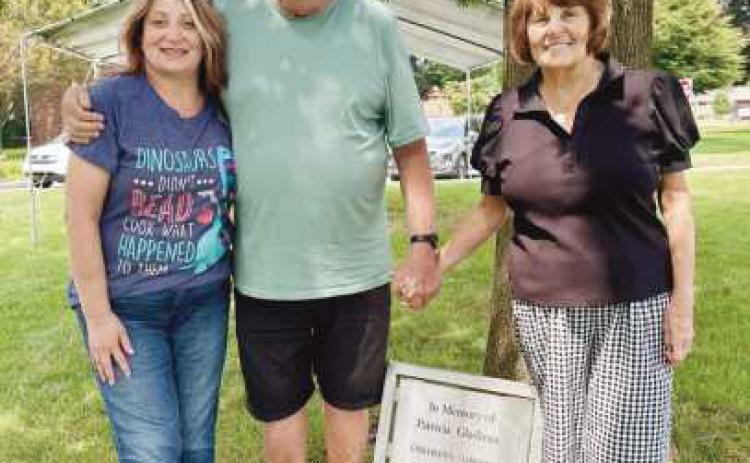 From left: Library Director Goldsmith, Patricia Gladieux’s son, Bill Gladieux, and Bill’s wife, Cindy Gladieux.