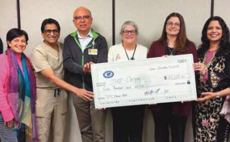 From left: Dr. Srini Hejeebu, Dr. Maneesha Pandey. Dr. Raj Kattar, Current TOPI President Dr. Sanjoy Banerjee, Cocoon Director of Development and Communications Robin Guidera, Cocoon Executive Director Kathy Mull, 2026 TOPI President Dr. Shalini Singh Coates and Dr. Rashmi Goyal Hejeebu.