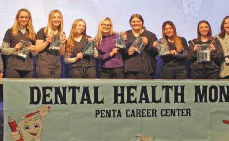Seniors in Penta’s dental assistant program presented sessions on the importance of oral hygiene to fellow classmates as part of National Children’s Dental Health Month. From left are Brenda Strauss, dental assistant program instructor; Jaycee Snyder, Erin Bouk, Abigail Lipinski, Brie’Ahna Nigh, Lela Weiss, Gabby Lockwood, Mackenzie Neal and Nicole Lingle, English instructor.
