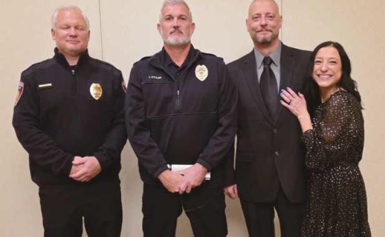 From left: Lieutenant Craig Revill, Chief Todd Kitzler, Sergeant Shawn Screptock and his wife, Candice Screptock.