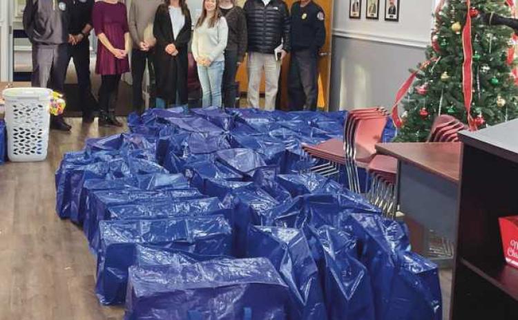 The City of Rossford was able to provide food for 45 families as well as gifts, needs and food to the two families the city adopted for the holidays, thanks to the generosity of the Rossford community. The city received over 1300 food items. Regan Findling from Rossford Schools collaborated with the city to provide a nice holiday for students and their families in need. The Rossford Schools maintenance crew helped pick up the donations.