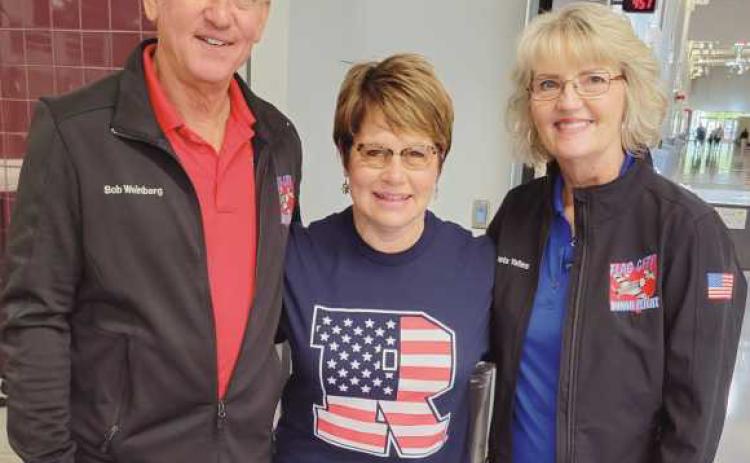 Rossford Association of Classroom Teachers donated $300 to SOS Club for the pancake breakfast, held May 11. SOS Club will donate the proceeds from the breakfast to Flag City Honor Flight and H.O.O.V.E.S. Pictured above center is Martha Fellman, adviser of the club, along with Bob Weinberg and Aleta Yates of Flag City Honor Flight.