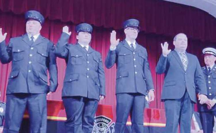 From left, Nick Frena, Allison Robinson , Michael Fox and Zach Bingham are sworn in.