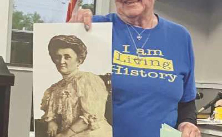 Judy Sikorski with a photo of Caroline Ross.
