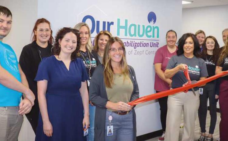 Crisis Team at ribbon cutting with Zepf Center CEO.