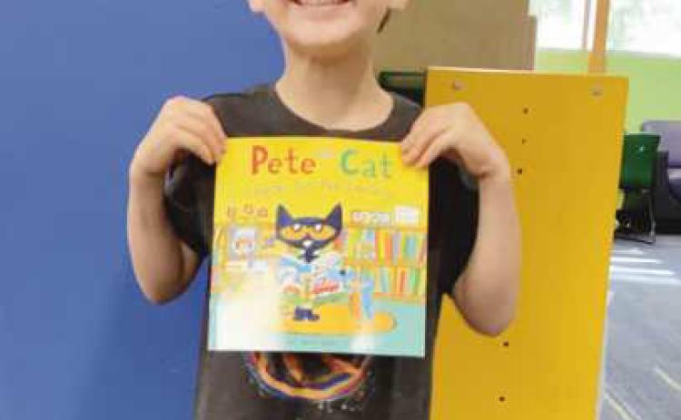 Rossford Public Library adds new member to 1,000 book club