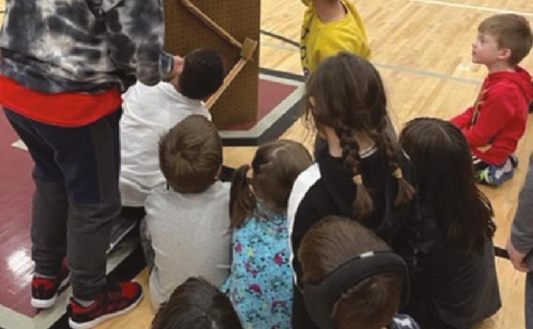 Children in the after-school CLC program worked in small groups to build a contraption that would allow gravity to bring the marble to a basket. Students then took turns watching their peers’ machines work.