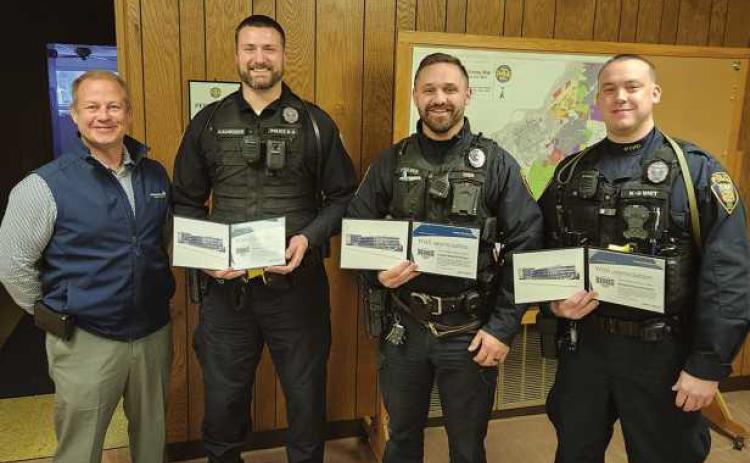 From left, Daniel Deiter of Modern Woodmen of America, presented Hometown Hero awards to Ptl. Kurt Schroeder, Ptl. Clayton Ringle and Ptl. Nicholas Owens.