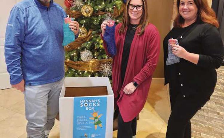 Citizen Advisory Group team members wearing crazy socks to kick off the sock drive.