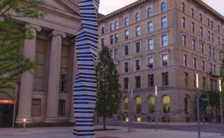 The Art Tatum Celebration Column by artist Cork Marcheschi, is a glowing, 27-foot spiraled column of powdercoated stainless steel and glass that represents the piano keys of the legendary jazz pianist, Art Tatum.