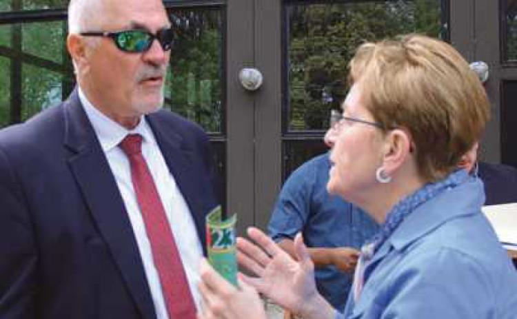 Congresswoman Marcy Kaptur discusses with Rex Huffman, Wood County Port Authority, funding for a proposed pedestrian/bike path bridge spanning the Maumee River and connecting Lucas and Wood counties’ trail systems.