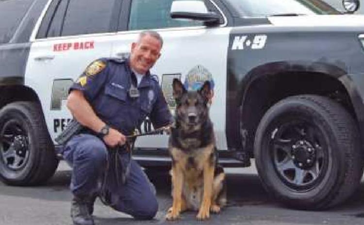At the April 20 meeting, the trustees held a moment of silence for K9 X who passed away of old age. Above is X with fellow officer and handler, Sergeant Jason Gladney. “X had been retired for several years,” Police Chief Mark Hetrick said.