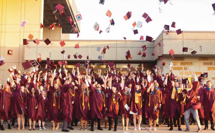 Following commencement ceremonies, Rossford graduates celebrate with the traditional tossing of their caps.