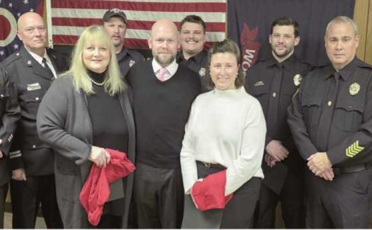 Back from left: Firefighter Todd Hager, Fire Captain Paul Weist, Firefighters Branden Abke and Sam Eiben, Police Sergeants Tyler Gearig and Scott Mezinger and Police Patrolman Andrew Watson. Front from left: Awardees Sarai Shaneck, Justin Bytner and Samantha Bytner.