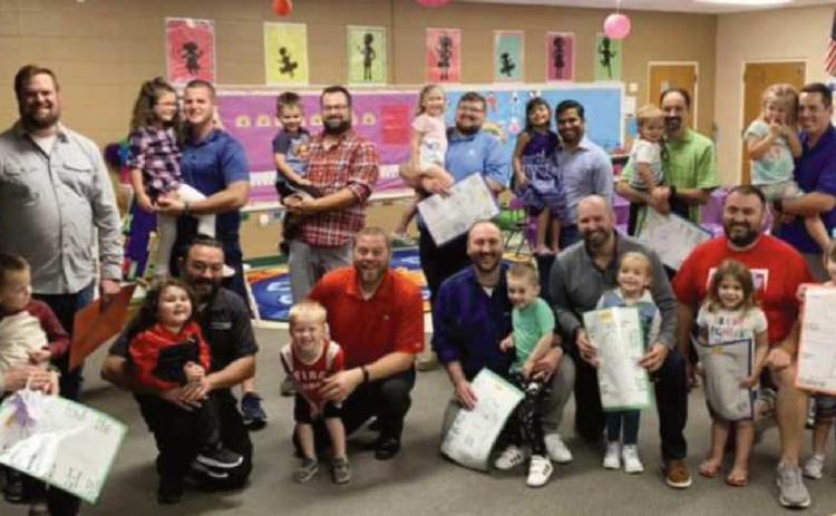 All Saints preschoolers welcome dads to class