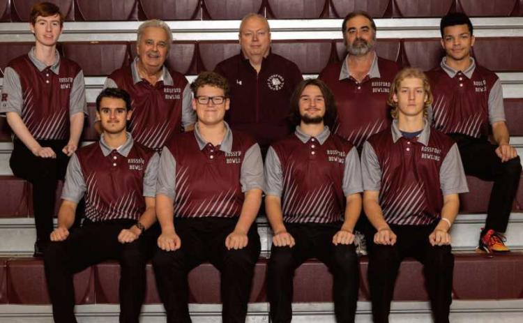 Rossford High School boys varsity bowling team members are, back row, from left: Ethan Jones, Coach Pinski, Coach Reno, Coach Baird, Owen Hill. Front row: Trevor Wayne, Owen Klocko, Billy Graffius and Quintan Borden.