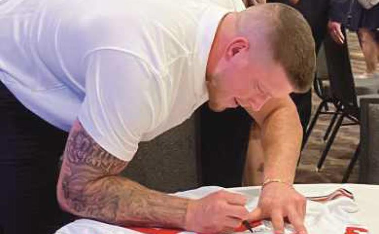 Jack Sawyer stayed for signatures and photos after speaking at the event.