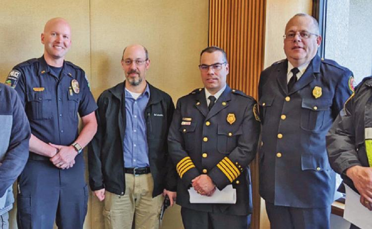 Local first responders joined their counterparts across Wood County to ask the commissioners to fund a $3.4 million countywide computer aided dispatch system. From left are Rossford Police Chief Todd Kitzler, Perrysburg Police Chief Patrick Jones, Perrysburg Township Sergeant Scott Moskowitz, Perrysburg Township Deputy Fire Chief Jim Rodriguez, Fire Chief Tom Brice and township police Lieutenant David Nixon.