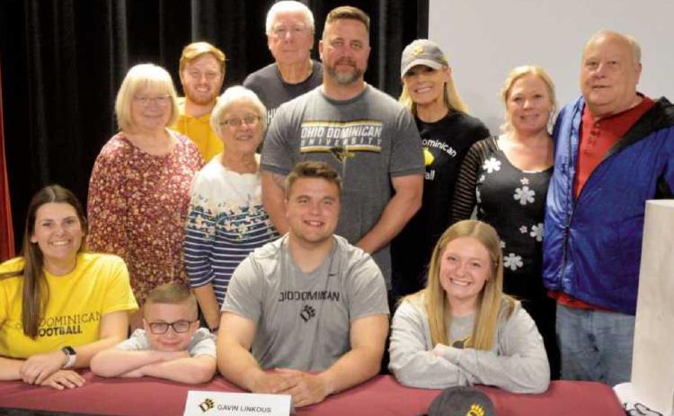 On Signing Day, Gavin, seated center, was joined by family members–standing from left, his grandmother Mary Smith, Logan Gauthier, grandmother Pat Linkous, grandfather Larry Linkous, parents Greg and Rachel Linkous, aunt Sarah Larson and grandfather Dennis Blair. Seated from left are his girlfriend Rylin Reynolds, brother Kaiden and sister Kelsey.