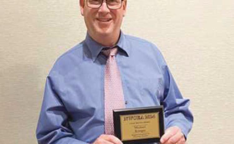 RHS teacher receives local service award