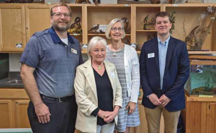 From left are Chris Smalley, park district director; Jeanne Lesniewicz of the Country Garden Club; Judy Lang, club president, and Tim Ansted, director of the Perrysburg Area Chamber of Commerce.