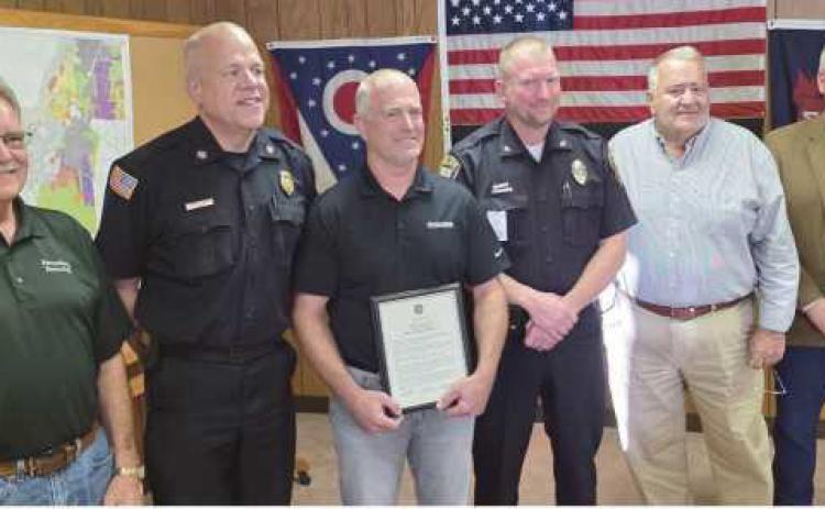 From left: Trustee Gary Britten, Fire Chief Tom Brice, Phil Eisel, Police Chief Matt Gazarek, Trustee Joe Schaller and Trustee Bob Mack.
