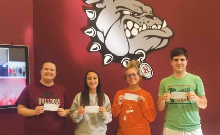 Award winners pictured from left, Grace Eckel, Allison Misko, Maci Bihn and Jonah Shafer with their scholarship checks.